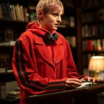 Darby-Hart-A-Murder-at-the-End-of-the-World-2023-Red-Coat